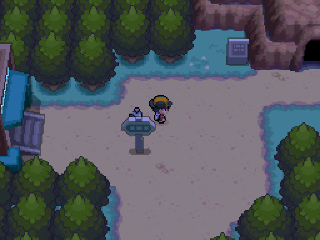 Outside Ecruteak City: a dirt path, trees all around, a signpost, a cave entrance to the east.