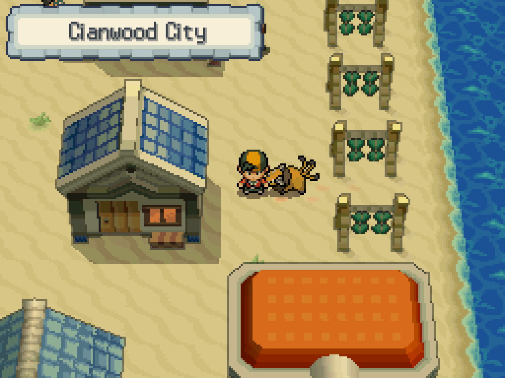 Arriving in Cianwood City: sandy beach, wooden houses with blue tile roofs, a Pokémon Centre.
