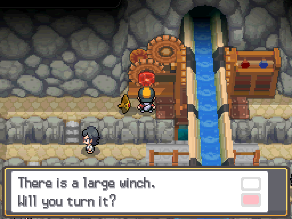At the back of the Cianwood Gym, examining a large machine.  A chute runs down the middle of the building and dumps water on the head of the gym leader.  Game Text: There is a large winch.  Will you turn it?