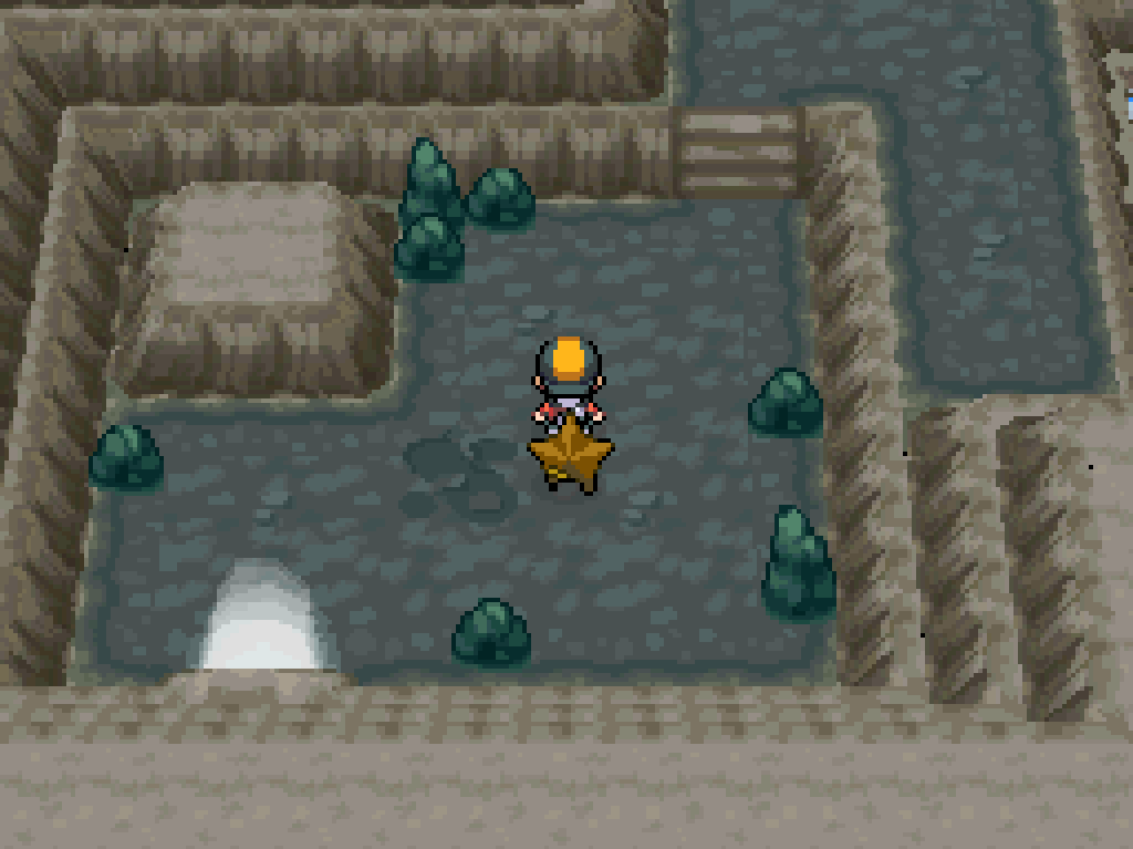 Inside Mount Mortar: stone walls and floor, scattered boulders.