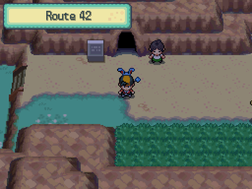 Stepping back out onto route 42. Cliffs to the north and south, some long grass.