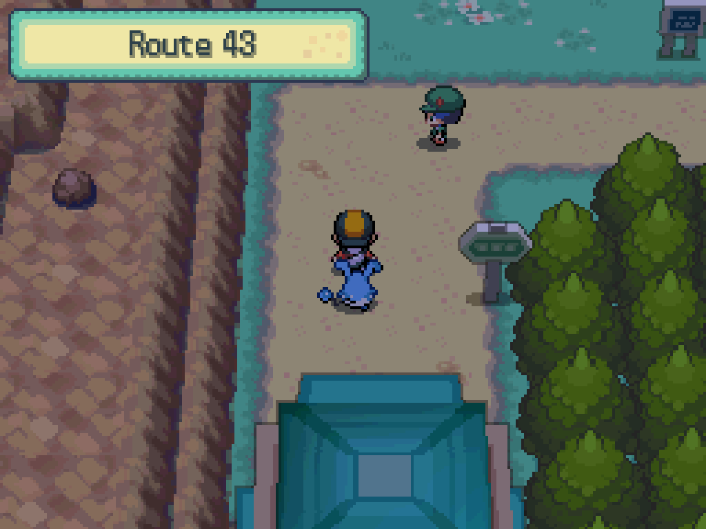 Stepping onto route 43: dirt path, trees to the east, cliffs to the west.